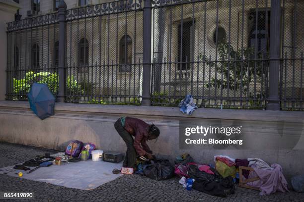 Person sells found items on a street in Rio de Janeiro, Brazil, on Thursday, Aug. 24, 2017. According to the World Bank, Brazil's economic and social...