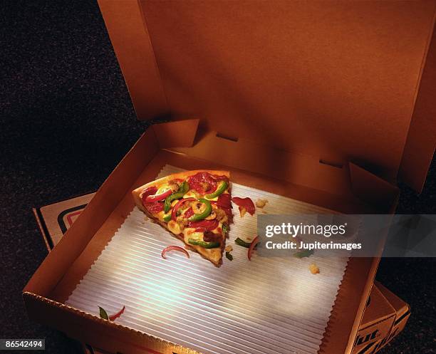 slice of pizza in a box - leftovers stock pictures, royalty-free photos & images