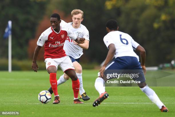 Flo Balogun of Arsenal is closed down by Oliver Skipp and Japhet Tanganga of Tottenham during the match between Tottehma Hotspur and Arsenal on...