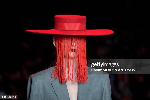 Model presents a creation by Russian designer Aslamova during the Mercedes-Benz Fashion Week Russia in Moscow on October 23, 2017.