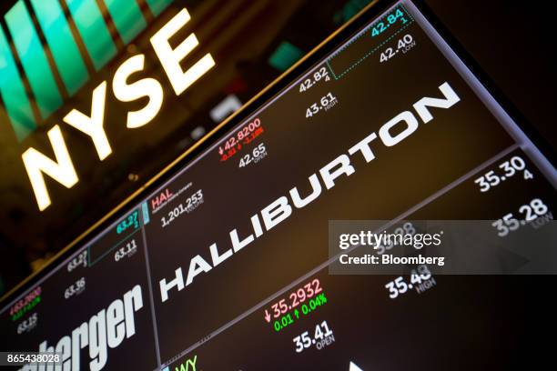 Monitor displays signage for Halliburton Co. On the floor of the New York Stock Exchange in New York, U.S., on Monday, Oct. 23, 2017. U.S. Stocks got...