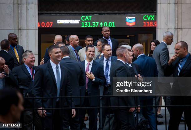 People exit the New York Stock Exchange in New York, U.S., on Monday, Oct. 23, 2017. U.S. Stocks got off to a slow start as investors prepared for a...