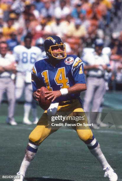 Dan Fouts of the San Diego Chargers drops back to pass against the Detroit Lions during an NFL football game September 30, 1984 at Jack Murphy...