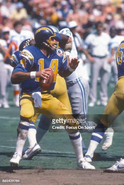 Dan Fouts of the San Diego Chargers drops back to pass against the Detroit Lions during an NFL football game September 30, 1984 at Jack Murphy...