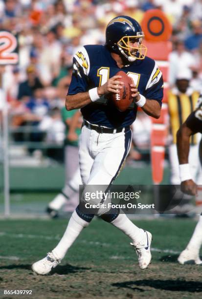 Dan Fouts of the San Diego Chargers drops back to pass against the Seattle Seahawks during an NFL football game December 14, 1986 at Jack Murphy...