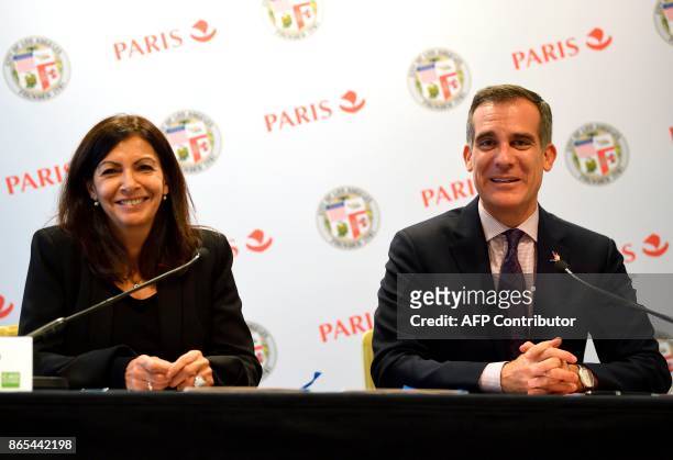 Paris mayor Anne Hidalgo and Los Angeles mayor Eric Garcetti attend an Olympic twinning cooperation agreement signing ahead of the 2024 and 2028...