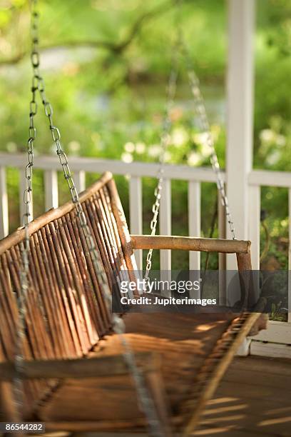 porch swing - swing chair stock pictures, royalty-free photos & images