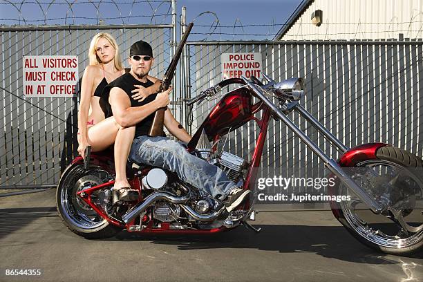 couple on motorcycle - women in skimpy bathing suits stock pictures, royalty-free photos & images
