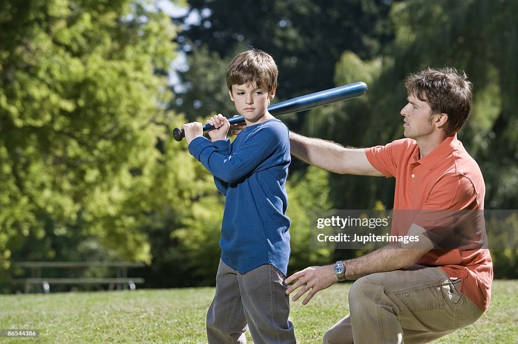 Father and son playing baseball