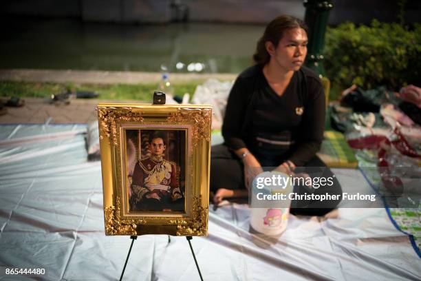 People begin to camp out on the roads surrounding the Royal Palace of Thailand's late King, Bhumibol Adulyadej, in preparation of the King's...