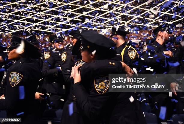 Some of the over 400 New York Police Departmentofficers gather as they graduate from the Police Academy in a ceremony held at the Madison Square...