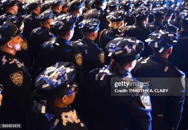 Some of the over 400 New York Police Departmentofficers gather as they graduate from the Police Academy in a ceremony held at the Madison Square...