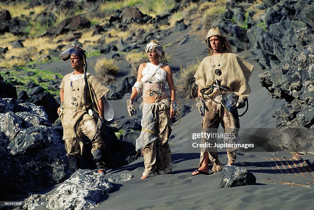 Apocalyptic people in desolate landscape