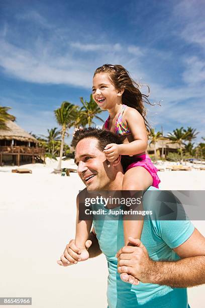 father and daughter at the beach - playa del carmen photos et images de collection