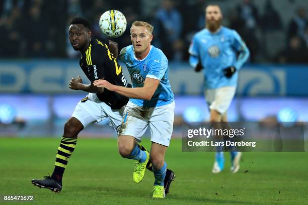 Chinedu Obasi of AIK and Franz Brorsson of Malmo FF during the allsvenskan match between Malmo FF and AIK at Swedbank Stadion on October 23, 2017 in...