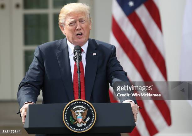 President Donald Trump delivers remarks during a joint statement with Singapore Prime Minister Lee Hsien Loong in the Rose Garden of the White House...