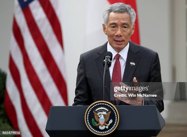 Singapore Prime Minister Lee Hsien Loong delivers remarks during a joint statement with U.S. President Donald Trump in the Rose Garden of the White...