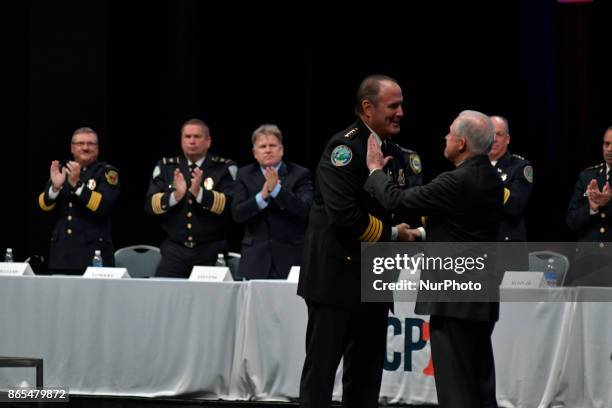 President Donald W. De Lucca welcomes US AG Jeff Sessions on stage during the General Assembly of the International Association of Chiefs of Police...