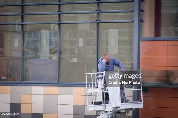 Worker is seen waiting while students sit in the Kazimierz the Great library in Bydgoszcz, Poland on October 23, 2017.