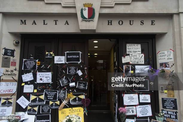 Messages, cartels and flowers have been left outside the Malta High Commission, for Daphne Caruana Galizia, at Malta House, London on October 23,...