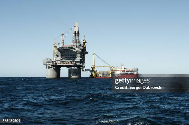 oil rig and support vessel on offshore area - oil rig support vessel stock pictures, royalty-free photos & images