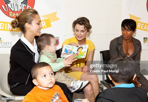 Jessica Alba, Keri Russell and Regina King read to children during Child Watch Day at the Unity Health Care Upper Cardozo Clinic on May 7, 2009 in...