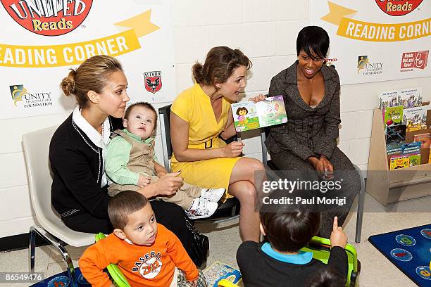 Jessica Alba, Keri Russell and Regina King read to children during Child Watch Day at the Unity Health Care Upper Cardozo Clinic on May 7, 2009 in...