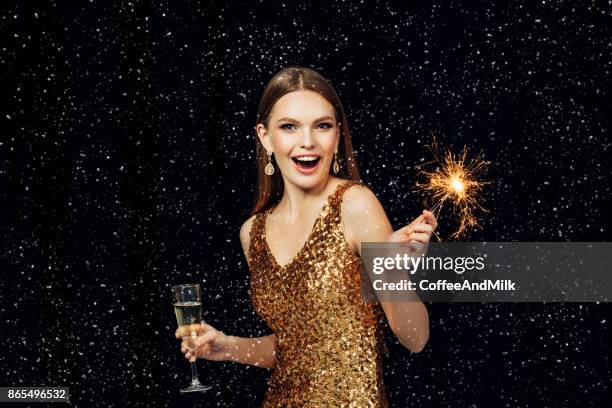 smiling girl with christmas sparkler - champagne flute milk stock pictures, royalty-free photos & images