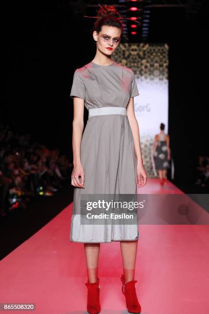 Model walks the runway at the Slava Zaitsev's Fashion Laboratory fashion show during day three of Mercedes Benz Fashion Week Russia S/S 2018 at...