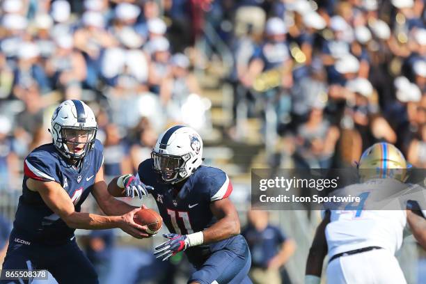 UConn Huskies quarterback Bryant Shirreffs and UConn Huskies running back Nate Hopkins during a college football game between Tulsa Golden Hurricane...