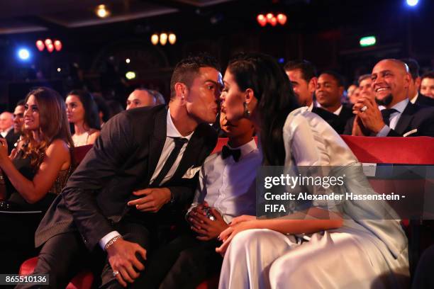 Cristiano Ronaldo kisses girlfriend Georgina Rodríguez after being announced the winner of The Best FIFA Men's Player award during The Best FIFA...