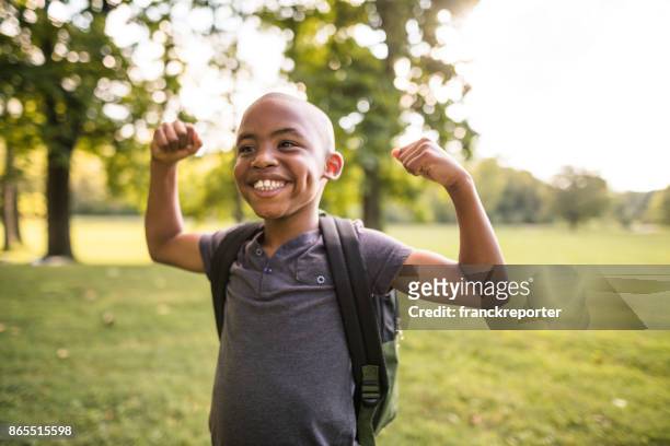 little kid showing the muscle - muscular build stock pictures, royalty-free photos & images