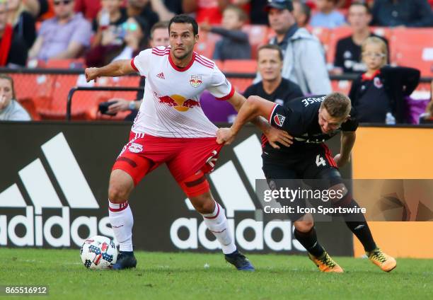 United midfielder Russell Canouse defends against New York Red Bulls midfielder Dilly Duka during D.C United's final MLS match at RFK Stadium between...