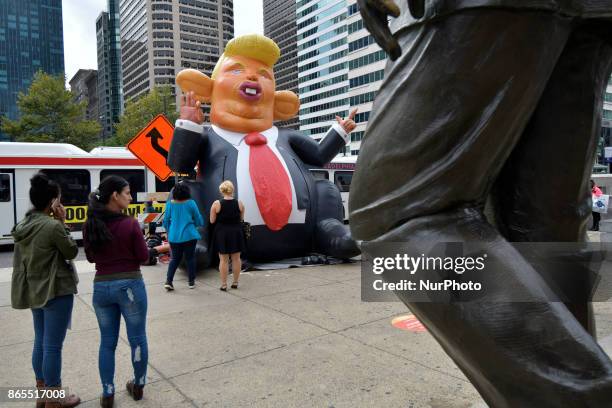 Pop-up inflatable 'Trump Rat' is erected facing the Frank Rizzo statue, in Center City Philadelphia, PA, on Rizzos birthday, October 23, 2017. In...