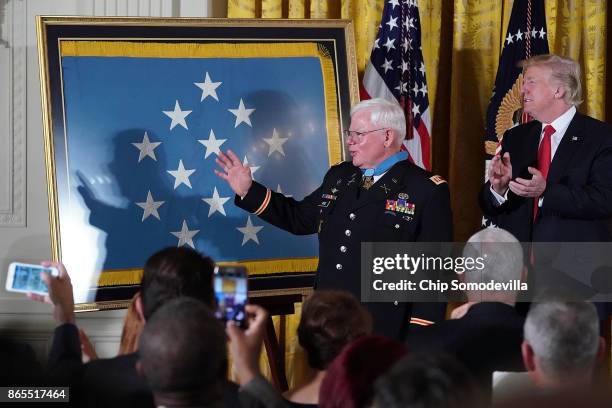 Retired U.S. Army Capt. Gary Rose receives a standing ovation after being awarded the Medal of Honor by U.S. President Donald Trump during a ceremony...