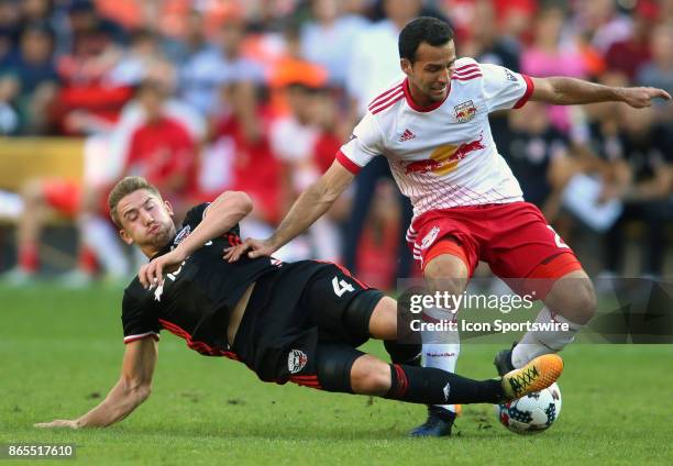 United midfielder Russell Canouse slide tackles New York Red Bulls midfielder Dilly Duka during D.C United's final MLS match at RFK Stadium between...