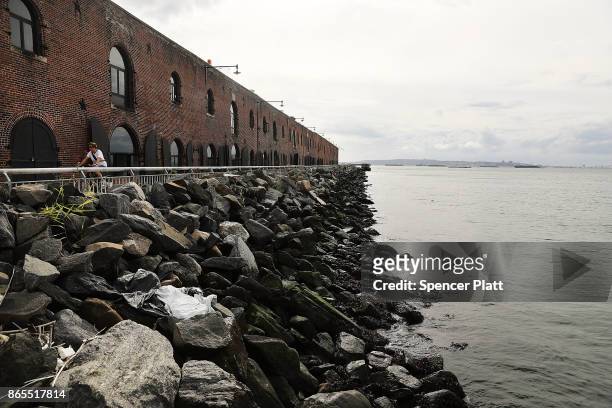 Rock barriers protect a building in Red Hook, Brooklyn on October 23, 2017 in New York City. Red Hook, like many coastal neighborhoods in New York,...