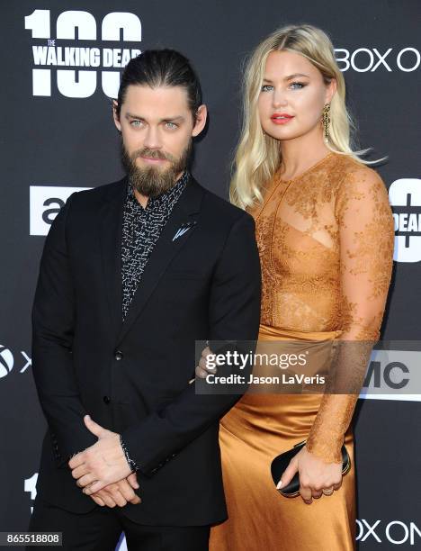 Actor Tom Payne and Jennifer Akerman attend the 100th episode celebration off "The Walking Dead" at The Greek Theatre on October 22, 2017 in Los...