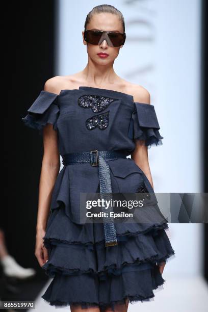 Model walks the runway at the Julia Dalakian fashion show during day three of Mercedes Benz Fashion Week Russia S/S 2018 at Manege on October 23,...