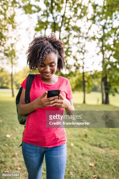 teenage woman using the smartphone - preteen girl models stock pictures, royalty-free photos & images