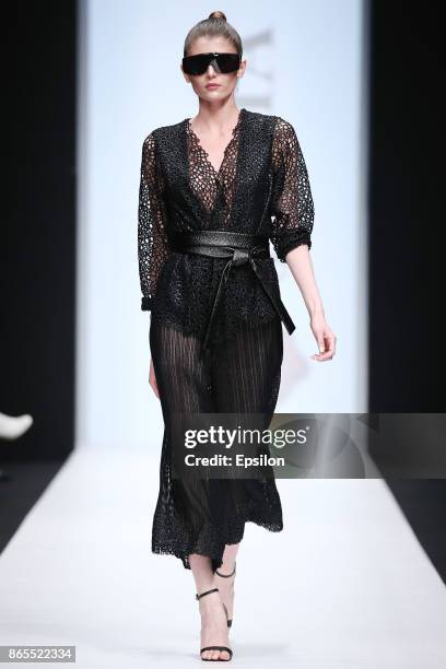 Model walks the runway at the Julia Dalakian fashion show during day three of Mercedes Benz Fashion Week Russia S/S 2018 at Manege on October 23,...