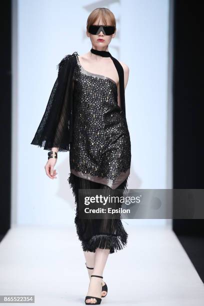 Model walks the runway at the Julia Dalakian fashion show during day three of Mercedes Benz Fashion Week Russia S/S 2018 at Manege on October 23,...