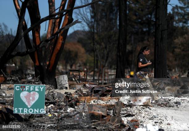 An insurance adjuster walks through a Coffey Park home that was destroyed by the Tubbs Fire on October 23, 2017 in Santa Rosa, California. Residents...