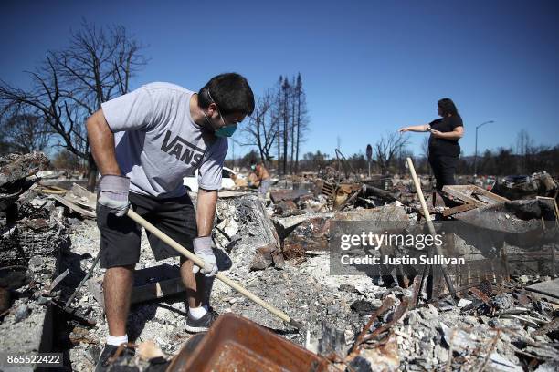 Ben Hernandez Jr. Sifts through the remains of his Coffey Park home that was destroyed by the Tubbs Fire on October 23, 2017 in Santa Rosa,...