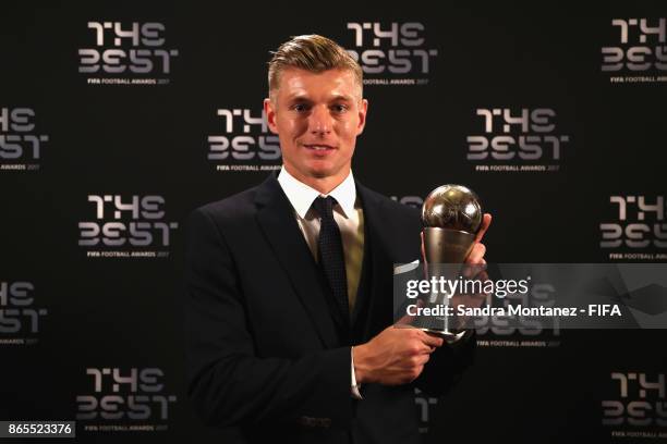 Toni Kroos of Real Madrid poses with his FIFA FIFPro World 11 award after being included in the team of the year after The Best FIFA Football Awards...