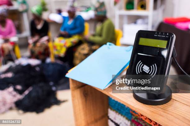 card reader on a table with a tablet - blank card table stock pictures, royalty-free photos & images