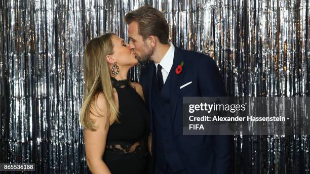 Harry Kane and his girlfriend Katie Goodland are pictured inside the photo booth prior to The Best FIFA Football Awards at The London Palladium on...