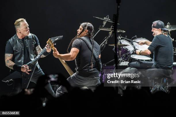 James Hetfield , Robert Trujillo and Lars Ulrich of Metallica perform live on stage at The O2 Arena on October 22, 2017 in London, England.