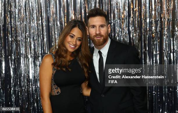 Lionel Messi and his wife Antonella Roccuzzo are pictured inside the photo booth prior to The Best FIFA Football Awards at The London Palladium on...