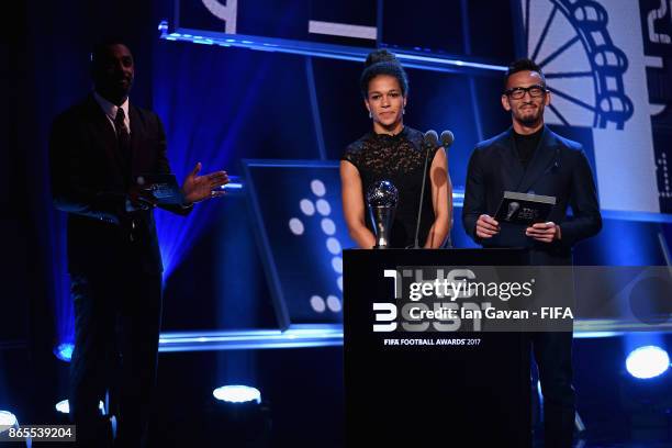 Japan's former player Hidetoshi Nakata and Germany's Celia Sasic come on stage to present The Best FIFA Women's Player during The Best FIFA Football...